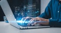 Person coding on a laptop with AI and data visualization interface programming software Royalty Free Stock Photo