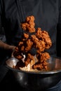 Person cooking some delicious boneless with buffalo sauce