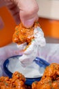 Person cooking some delicious boneless with buffalo sauce