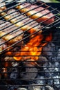 Person cooking steaks on a barbecue grill