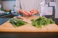 A person is cooking vegetables