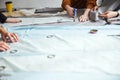 Adult using dressmaking shears on fabric piece