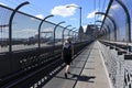 Person crossing Sydney Harbour Bridge in Sydney Australia