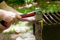 Hands with axe and wood