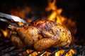 A person is currently cooking a chicken over a blazing fire using a fork Royalty Free Stock Photo