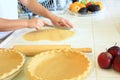 Person cutting dough for an Apple Pie Royalty Free Stock Photo