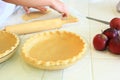 Person cutting dough for an Apple Pie Royalty Free Stock Photo