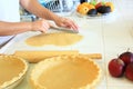 Person cutting dough for an Apple Pie Royalty Free Stock Photo