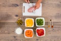 Person Cutting Meat On Chopping Board