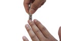 Person cutting nail with a cutter isolate on white background. Royalty Free Stock Photo