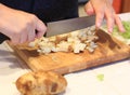 Person cutting Potatoes into small cubes