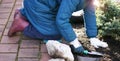 Person diggin ground in a garden. Agriculture consept.