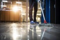 A person diligently mopping the floor for a spotless and shiny result