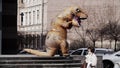 Person in dinosaur costume prankster running in front of shop