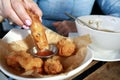 Person dipping Vietnamese Shrimp Spring Roll into sauce Royalty Free Stock Photo