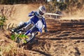 Person, dirt bike and professional motorcyclist in extreme sports, competition or race on outdoor track. Expert rider on Royalty Free Stock Photo