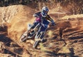 Person, dirt track and professional motorcyclist on bike for extreme sports, competition or outdoor race. Expert rider Royalty Free Stock Photo