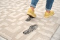 Person in dirty shoes leaving muddy footprints Royalty Free Stock Photo