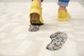 Person in dirty shoes leaving muddy footprints Royalty Free Stock Photo