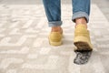 Person in dirty shoes leaving muddy footprints Royalty Free Stock Photo