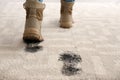 Person in dirty shoes leaving muddy footprints Royalty Free Stock Photo