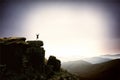 Happy man jumping for joy on the peak of the mountain. Success Royalty Free Stock Photo