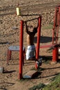 Person doing physical activity in street gym