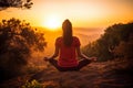 a person doing yoga on the mountain while the sun is setting