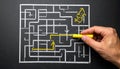 Person drawing solution path through a chalk maze on blackboard representing problem solving, creativity, and finding direction in Royalty Free Stock Photo