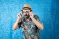 Person dressed as a tourist and a hat