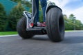 Person driving electric self-balancing scooter