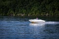 Person driving motor boat on the Hudson River