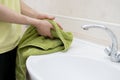 a person drying hands with towel in bathroom, washing dirty hands Royalty Free Stock Photo