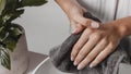 Person drying her hands towel close up . High quality and resolution beautiful photo concept Royalty Free Stock Photo