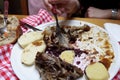 Person eating roasted duck