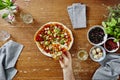 Person eating slice of pizza point of view