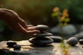 Person engaged in a mindful activity such as balancing stones, arranging flowers, or practicing tai chi, symbolizing harmony and