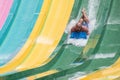 Person enjoying colorful Tamauta Racer attraction at Aquatica 3