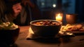 a person enjoying a hearty bowl of homemade chili packed with beans, AI Generated