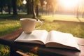 person, enjoying quiet moment with coffee and book in park