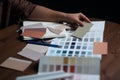 Interior design color selection process with paint and material samples on wooden table, Interior design process Royalty Free Stock Photo