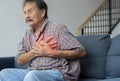 A person experiences chest pain caused by a heart attack. Heart disease. Angina pectoris Royalty Free Stock Photo