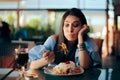 Woman Feeling Sick While Eating Huge Meal Royalty Free Stock Photo