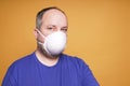 Person with face mask or dust mask or filtering facepiece respirator or breathing protection