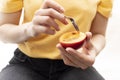 Person, Female Eating Fresh Tamarillo, Fresh Tropical Exotic Fruit With Spoon. Egg-shaped