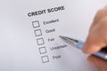 Person Filling Credit Score Form