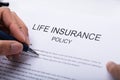 Person Filling Life Insurance Policy Form Royalty Free Stock Photo