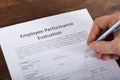 Person Filling A Performance Evaluation Form Royalty Free Stock Photo