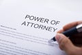 Person Filling Power Of Attorney Form