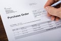 Person Filling A Purchase Order Form Royalty Free Stock Photo